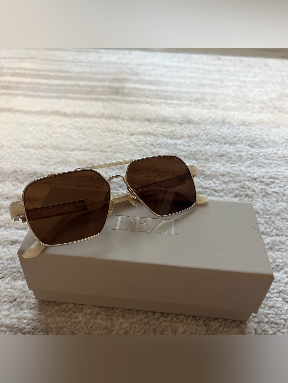 DEZI Clear Frame Sunglasses with Brown Lenses and Gold Accents